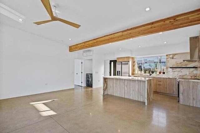 kitchen with stainless steel refrigerator with ice dispenser, beam ceiling, and a large island