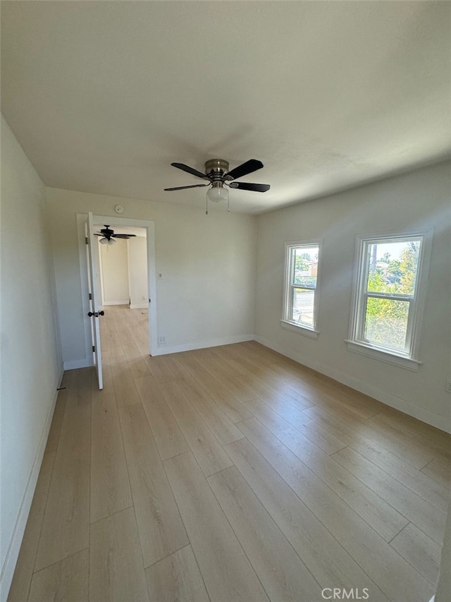 spare room with light hardwood / wood-style floors