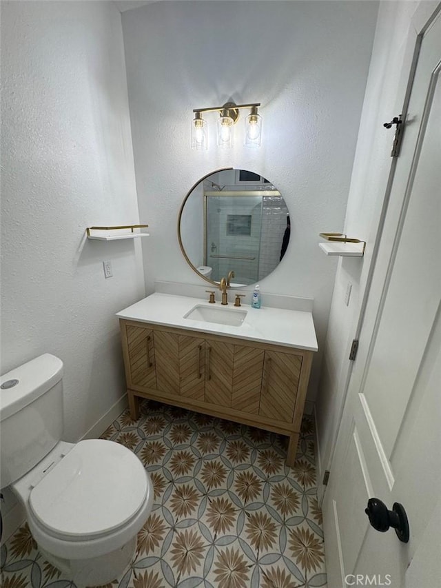 bathroom featuring toilet and vanity