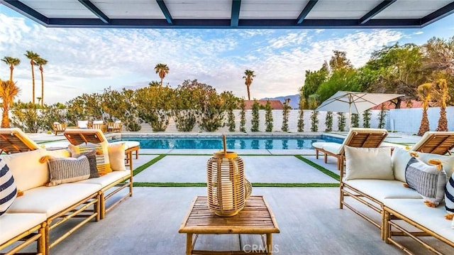 view of swimming pool featuring an outdoor living space and a patio