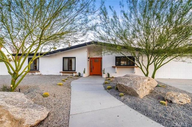 ranch-style home featuring a garage