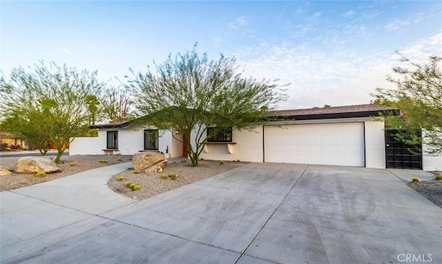 ranch-style house featuring a garage