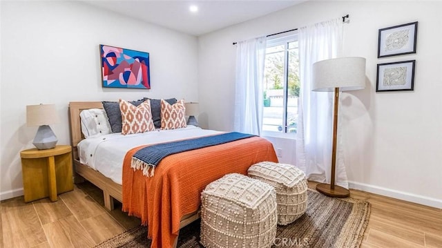 bedroom with wood-type flooring