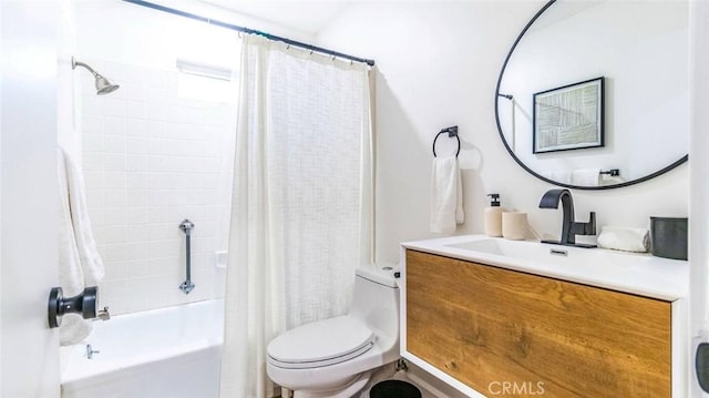 full bathroom featuring shower / bath combination with curtain, vanity, and toilet