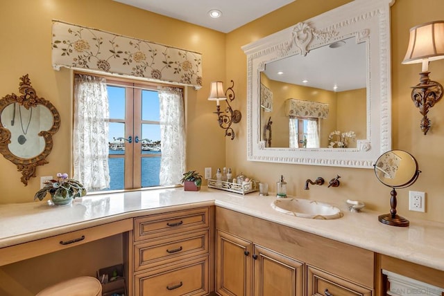 bathroom with vanity and a water view