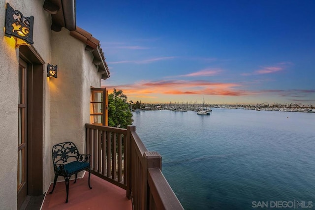 balcony at dusk with a water view