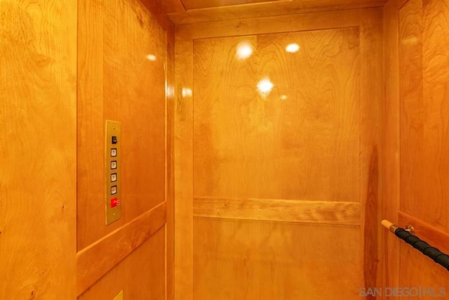 interior details with elevator and wood walls