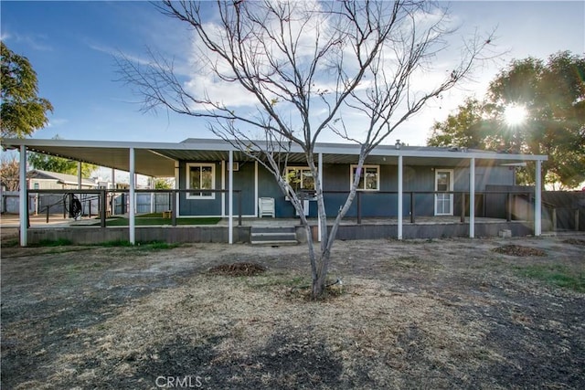 view of front facade with a carport