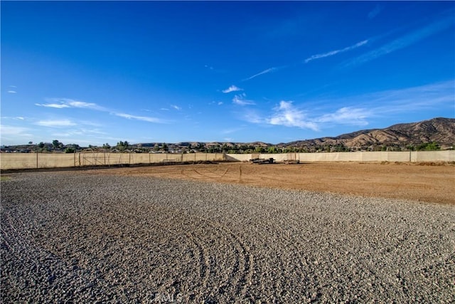 view of yard featuring a mountain view and a rural view