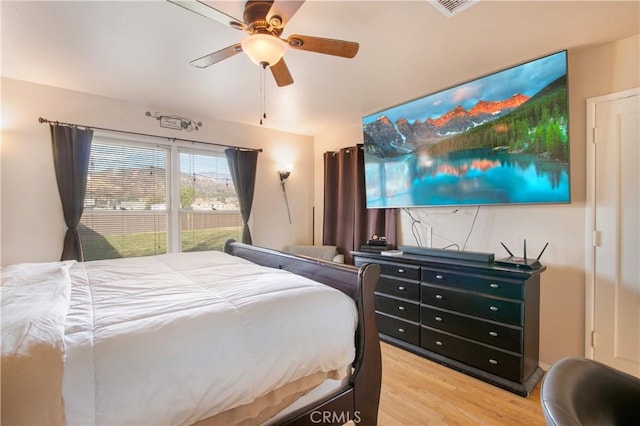 bedroom with hardwood / wood-style flooring and ceiling fan