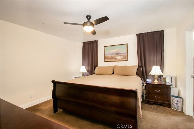 bedroom with ceiling fan and dark carpet