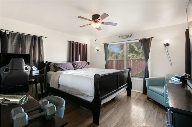 bedroom featuring ceiling fan and wood-type flooring