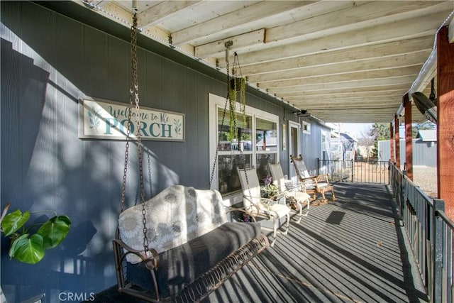 wooden terrace featuring covered porch