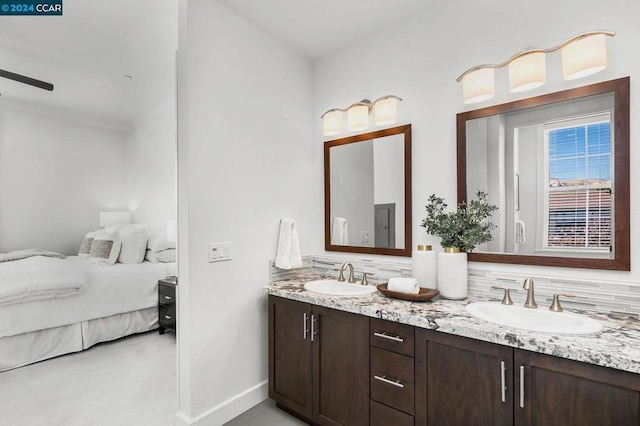 bathroom with vanity and tasteful backsplash