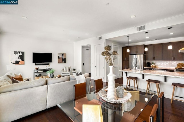 dining room with dark hardwood / wood-style flooring