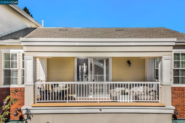 doorway to property featuring a porch