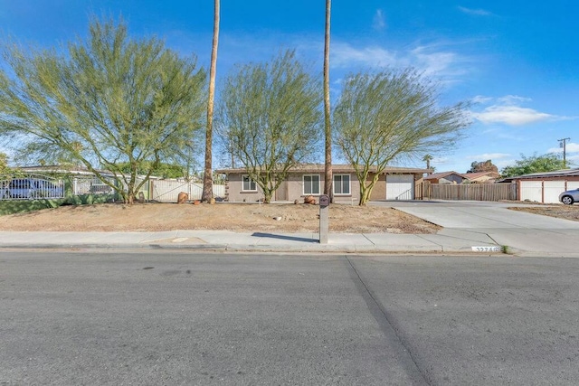 single story home featuring a garage