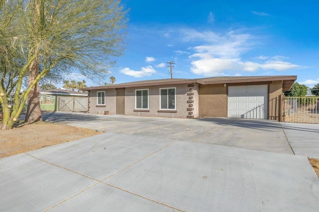 ranch-style home featuring a garage