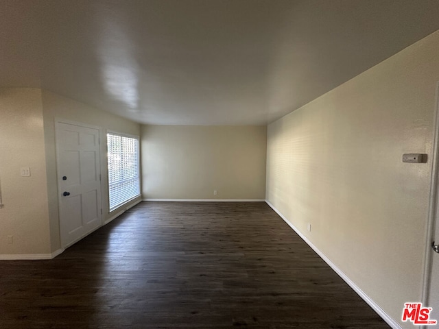 interior space with dark hardwood / wood-style floors