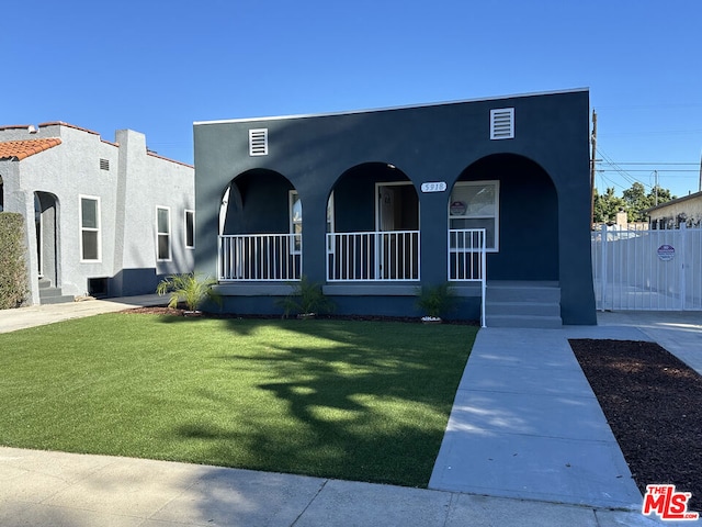 view of front of home featuring a porch and a front yard