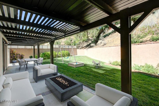 view of patio / terrace with an outdoor living space with a fire pit