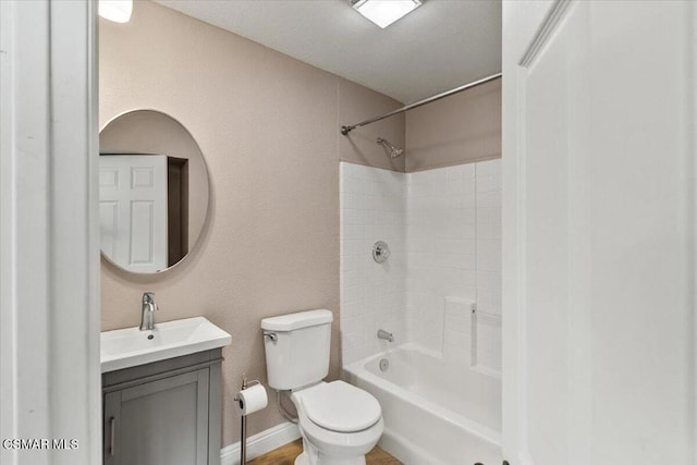 full bathroom with vanity, tub / shower combination, and toilet