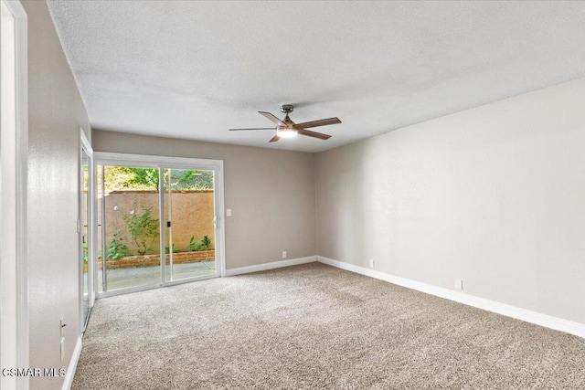 empty room featuring carpet, a textured ceiling, and ceiling fan