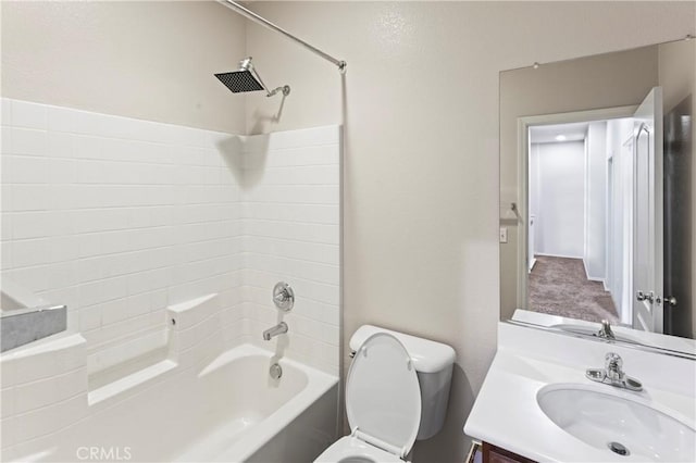 full bathroom featuring vanity, bathtub / shower combination, and toilet