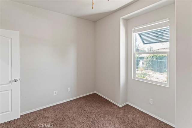 empty room with carpet flooring