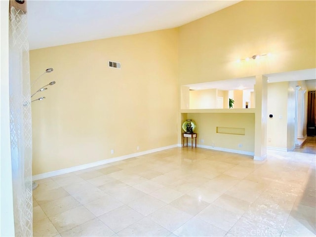 spare room with lofted ceiling