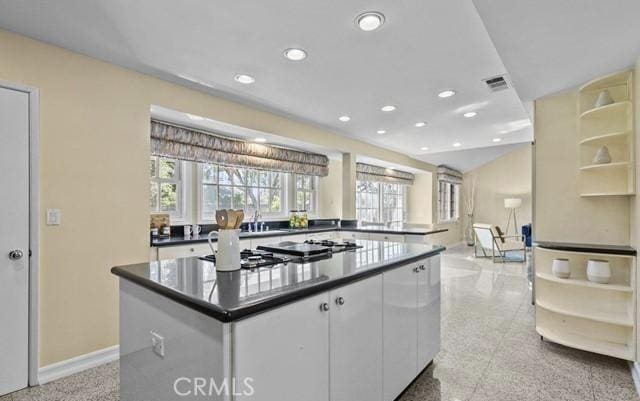 kitchen featuring white cabinetry and a kitchen island