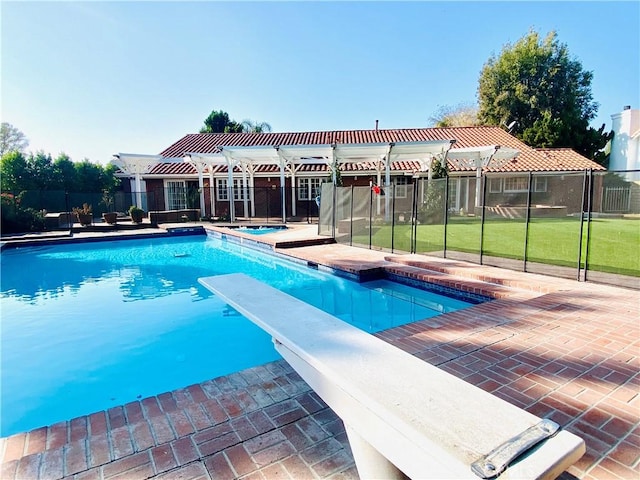 view of pool featuring a patio area, an in ground hot tub, a diving board, and a pergola