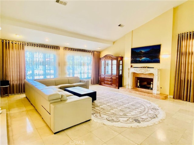 tiled living room with lofted ceiling and a premium fireplace