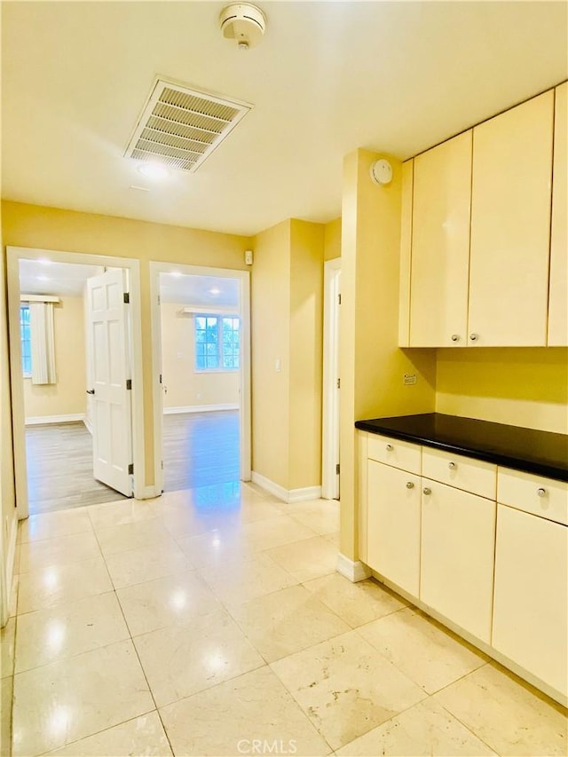 kitchen featuring white cabinetry