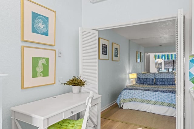 bedroom with wood-type flooring