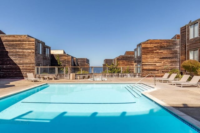 view of swimming pool featuring a patio