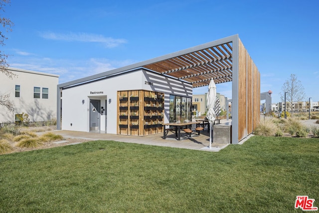 exterior space featuring a pergola and a yard