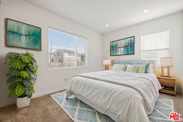 bedroom with light colored carpet