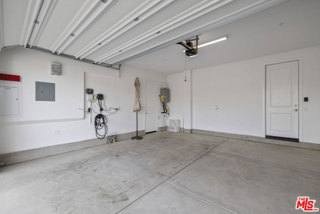 garage featuring electric panel and a garage door opener