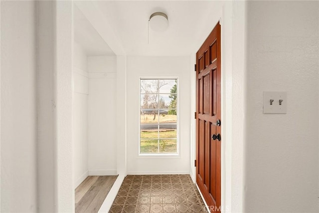 doorway to outside with hardwood / wood-style flooring