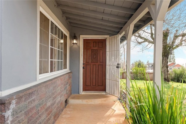 doorway to property featuring a porch