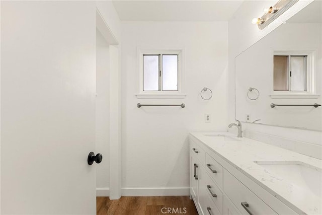 bathroom featuring hardwood / wood-style flooring and vanity