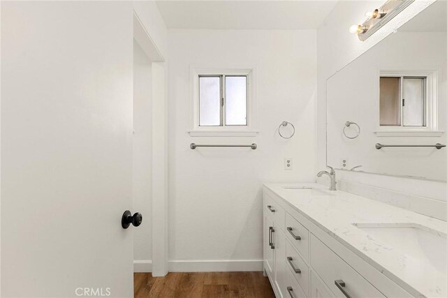 5690 Paradise Ave, Paradise, CA 95969 - full bath featuring baseboards, double vanity, and wood finished floors