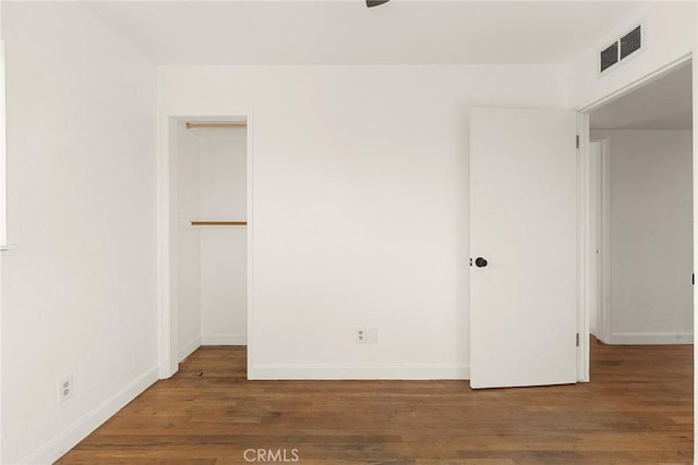 empty room with hardwood / wood-style floors