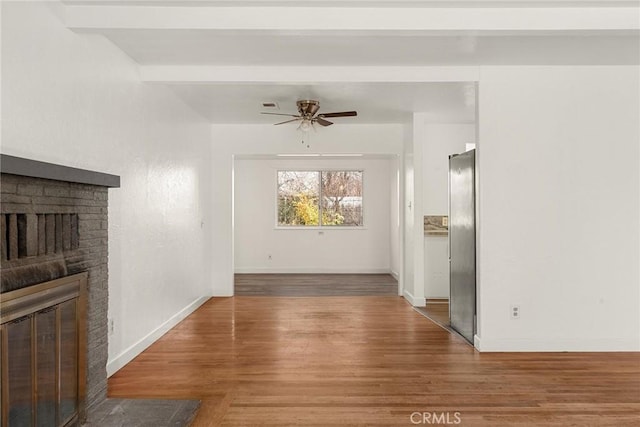 interior space with hardwood / wood-style flooring and beamed ceiling