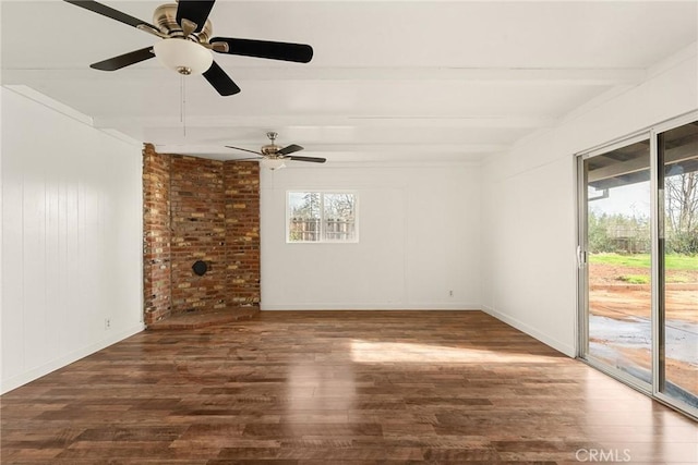 empty room featuring dark hardwood / wood-style floors, beam ceiling, and ceiling fan