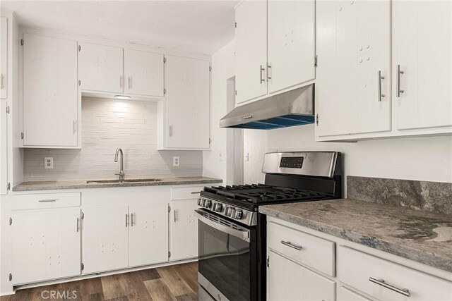 5690 Paradise Ave, Paradise, CA 95969 - kitchen with under cabinet range hood, stainless steel gas range oven, a sink, and white cabinets