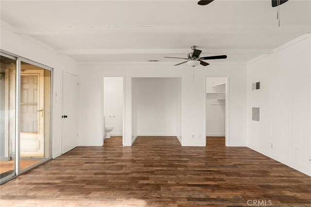 5690 Paradise Ave, Paradise, CA 95969 - unfurnished bedroom with wood finished floors, beam ceiling, a ceiling fan, a walk in closet, and baseboards