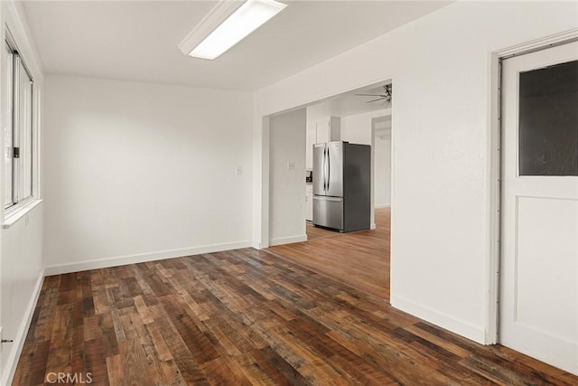 empty room featuring dark hardwood / wood-style floors and ceiling fan