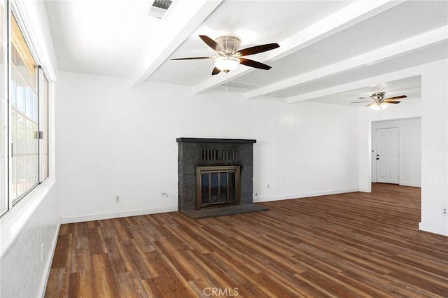 5690 Paradise Ave, Paradise, CA 95969 - unfurnished living room with ceiling fan, beamed ceiling, wood finished floors, a fireplace, and baseboards